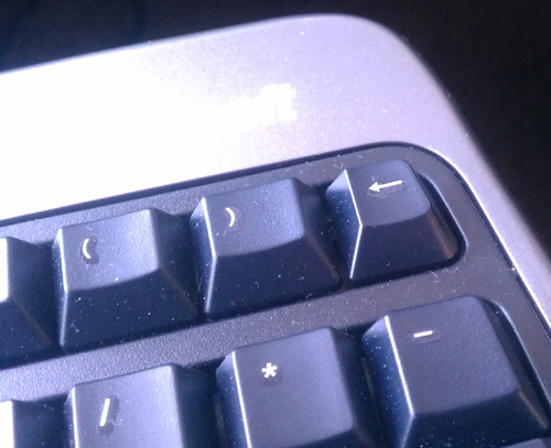 extra backspace key located above keypad minus