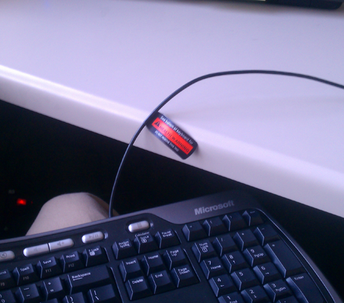 keyboard on lap bumps against desk